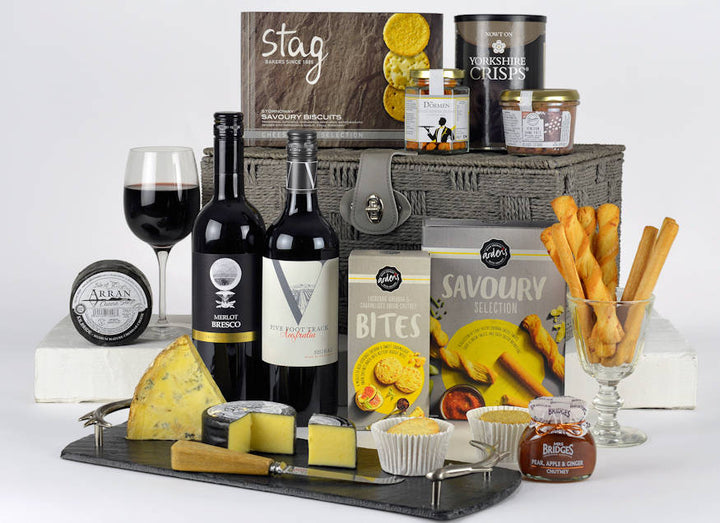 Cheese Lovers Choice Hamper - Grey basket with two bottles of red wine and savoury snacks with cheese and chutney