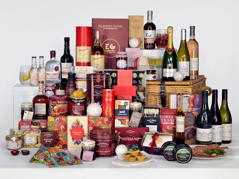 Luxury food and drink hamper including gin, champagne, wines, rum, port, whisky and liqueurs as well as luxury christmas food items in a luxury wicker basket hamper