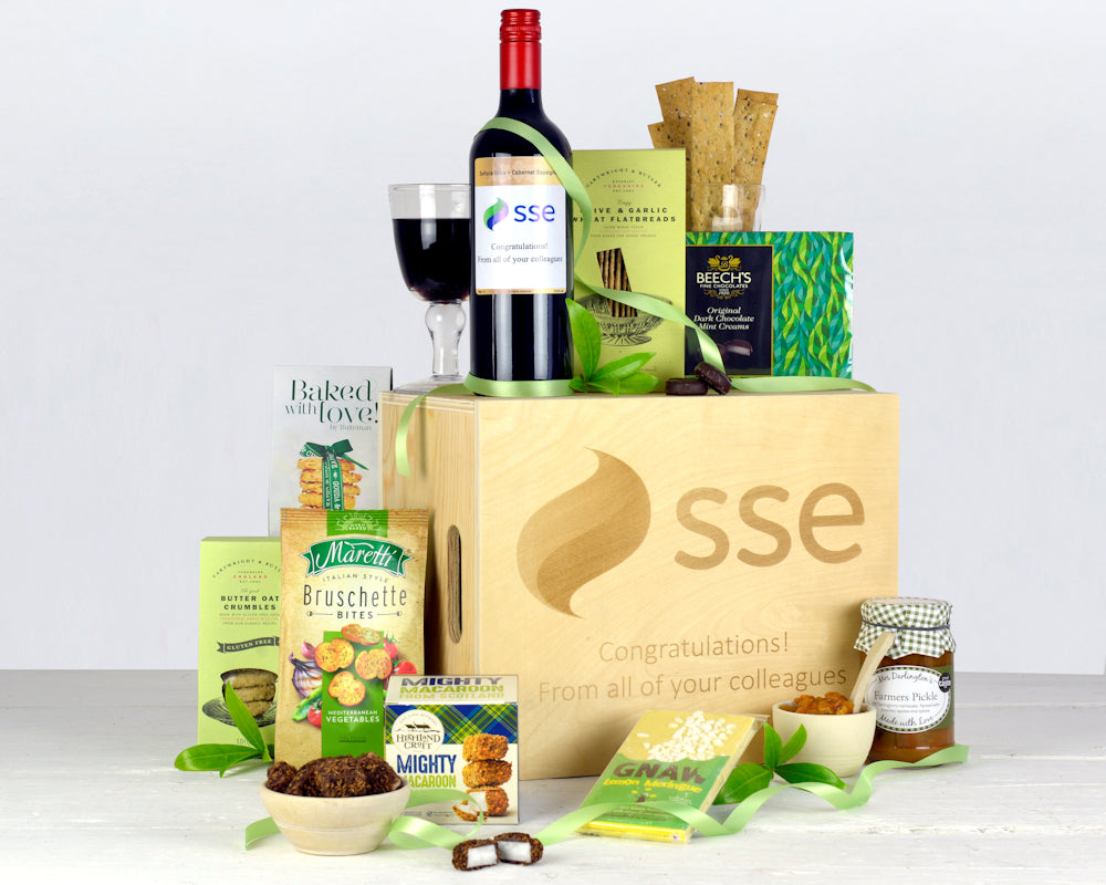 personalised bottle of red wine with savoury and sweet treats in a wooden gift box with engraved personalised message