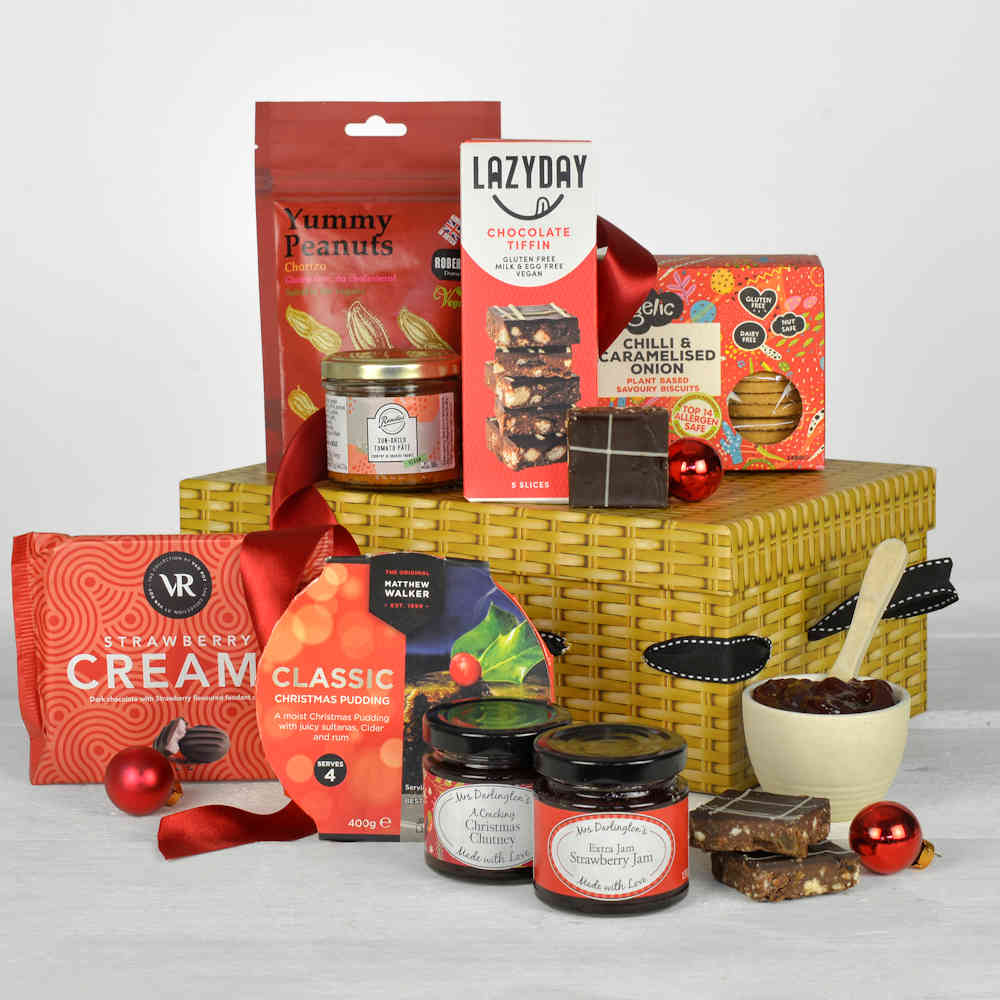 Christmas food treats that are all Vegan including christmas pudding, chocolates, jam, chutney and savoury snacks in a gift box