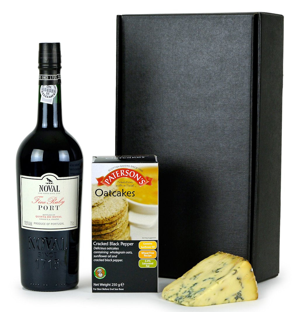 A bottle of fine ruby port, oatcakes and cheese in a black gift box