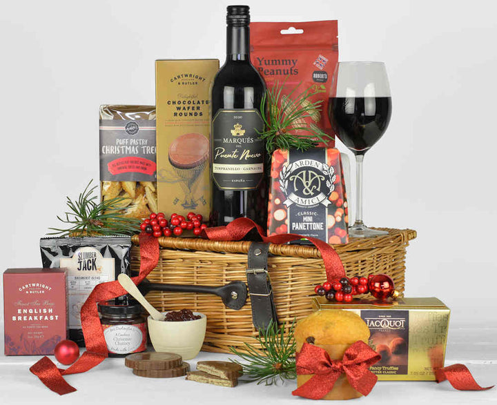 Christmas Eve Gift Basket with red wine Christmas panettone, chocolates, tea, coffee and other tasty snack food items