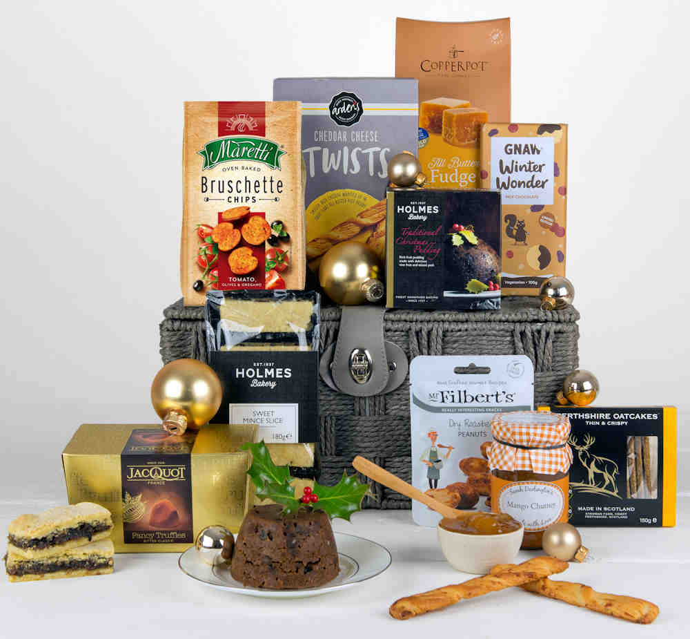 Christmas Hamper with tasty Mince Pie Slices, Christmas Pudding, fudge, chocolates and savoury snacks in a grey gift basket.