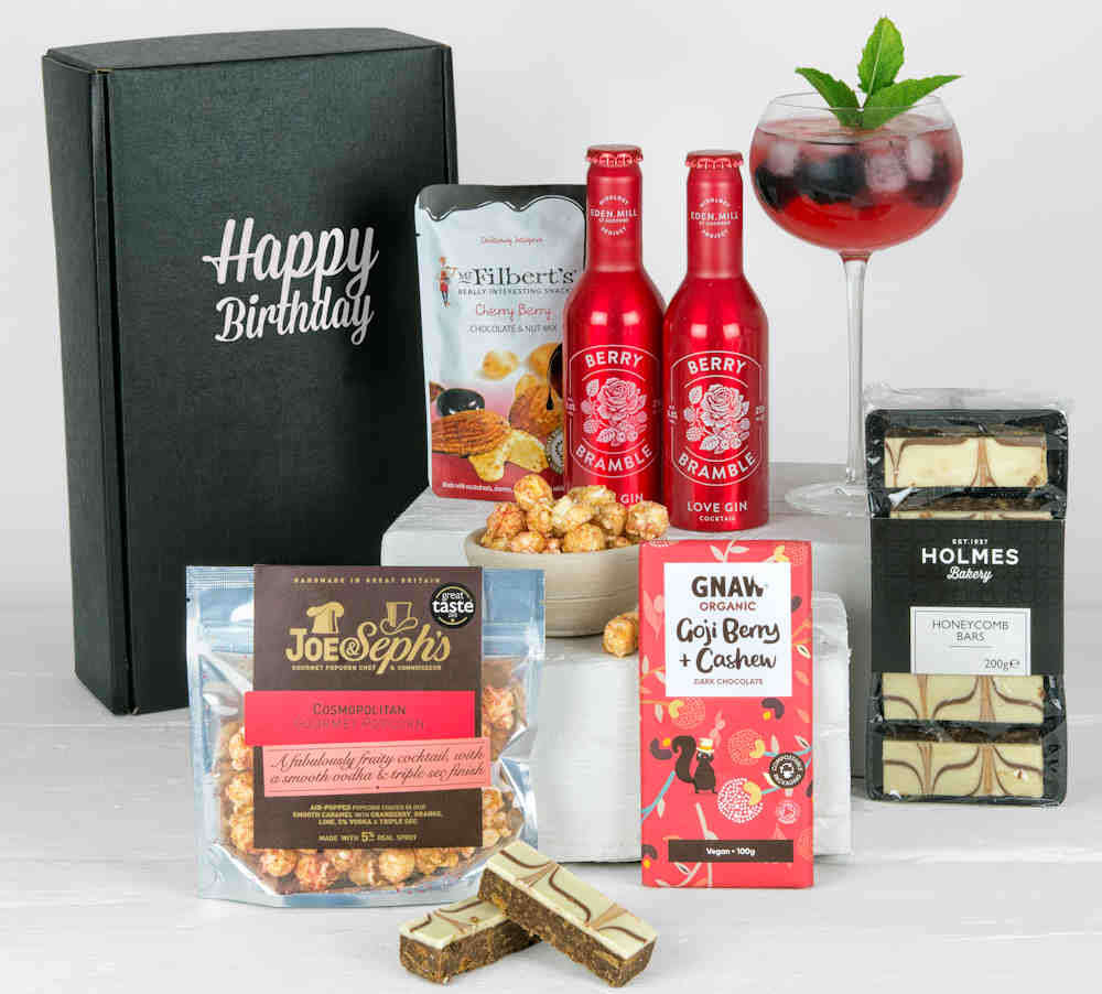2 Berry Cocktails, popcorn, chocolate bar and other sweet treats in a Happy Birthday Gift Box