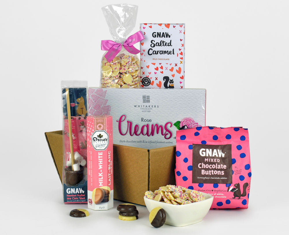 Chocolate buttons, chocolate creams, chocolate bar and other chocolate treats in a gift tray