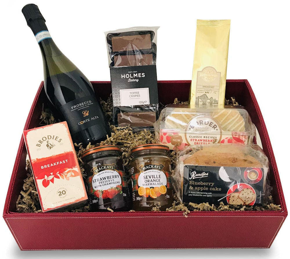 Luxury Red Leatherette Tray with a bottle of prosecco, tea, coffee, preserves, traybakes, cake and biscuits