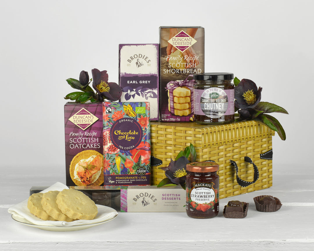 Scottish Food including shortbread, chocolates, strawberry preserve, tea and chutney in a gift box with ribbon