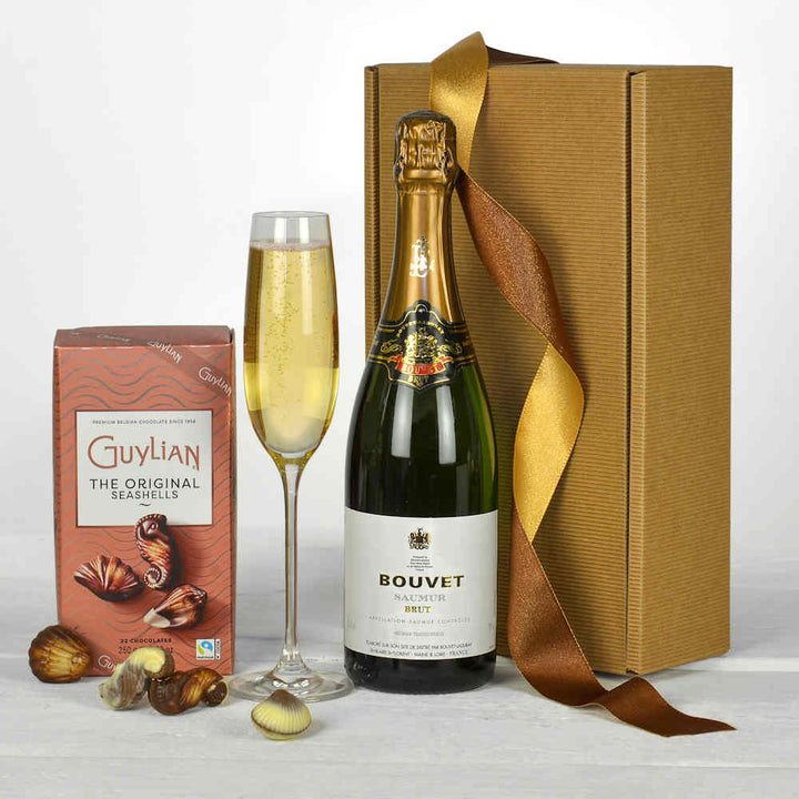 a bottle of Bouvet sparkling wine and chocolats in a natural gift box all made from sustainable companies