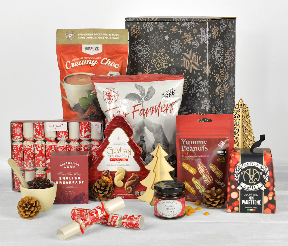 christmas themed products including panettone, christmas chocolates and mini christmas crackers in a sustainable gift box