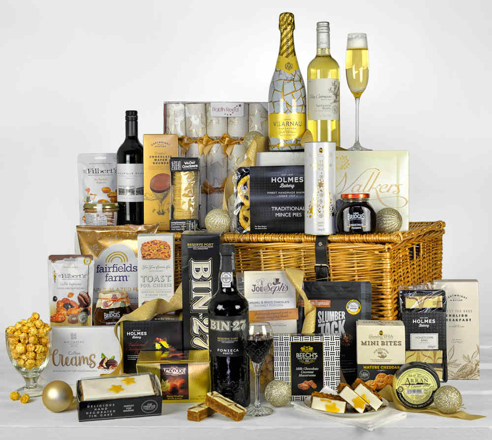 Luxury Wicker Basket filled with luxury christmas food and a bottle of sparkling wine, wines and port