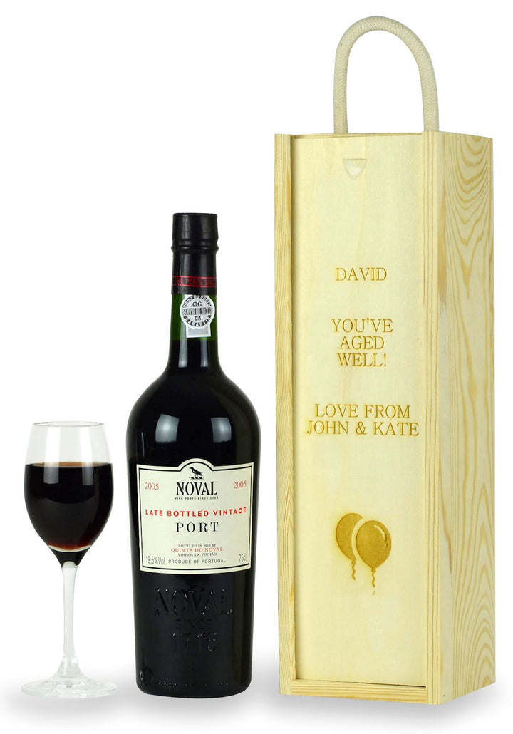 a bottle of lbv port with an engraved wooden box;